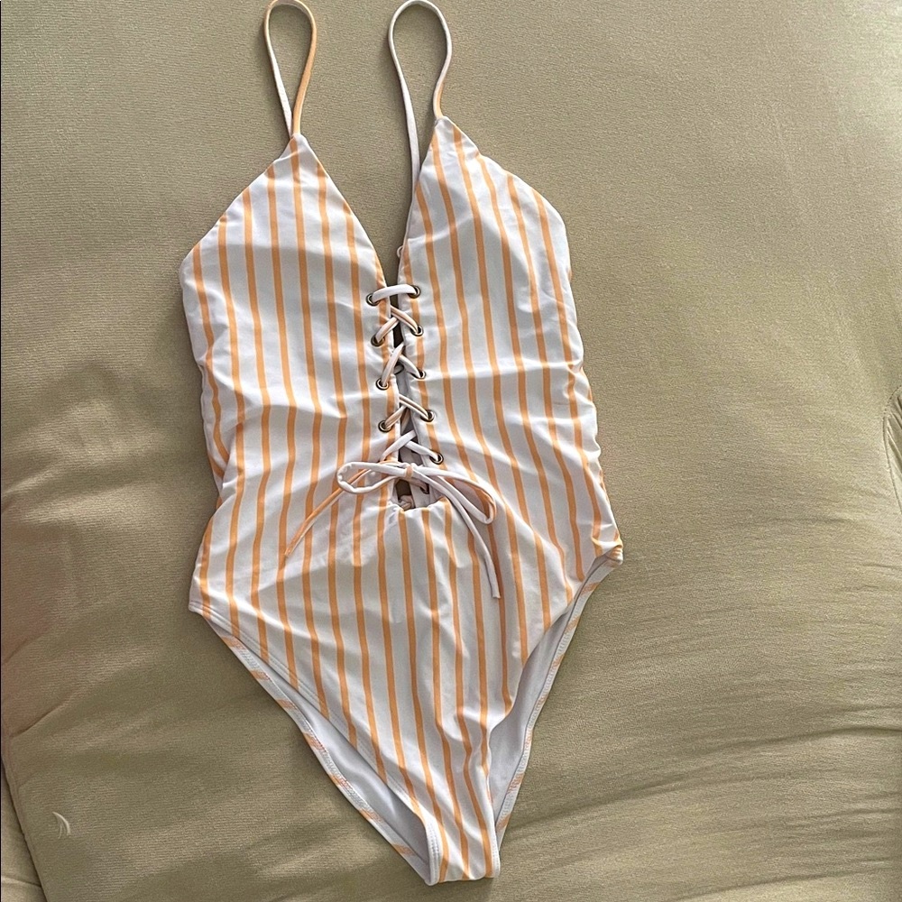 White and Orange One Piece Swimsuit with Sleek Design
